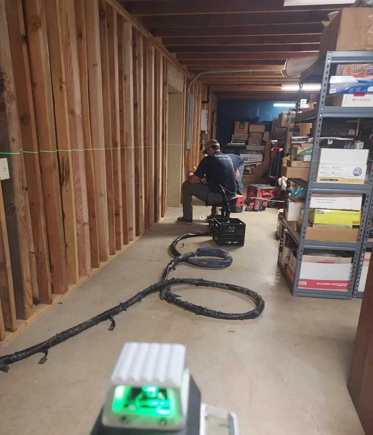 Foundation repair crew working on a Fayetteville home